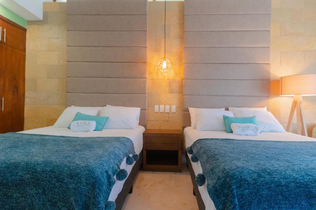Postel nebo postele na pokoji v ubytování Mayan Playa Bacalar