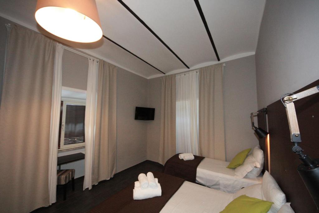 Postel nebo postele na pokoji v ubytování Hotel Felice