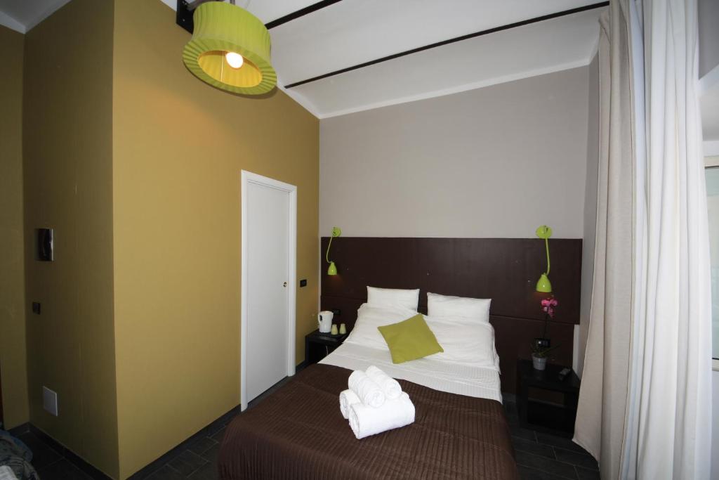 Postel nebo postele na pokoji v ubytování Hotel Felice