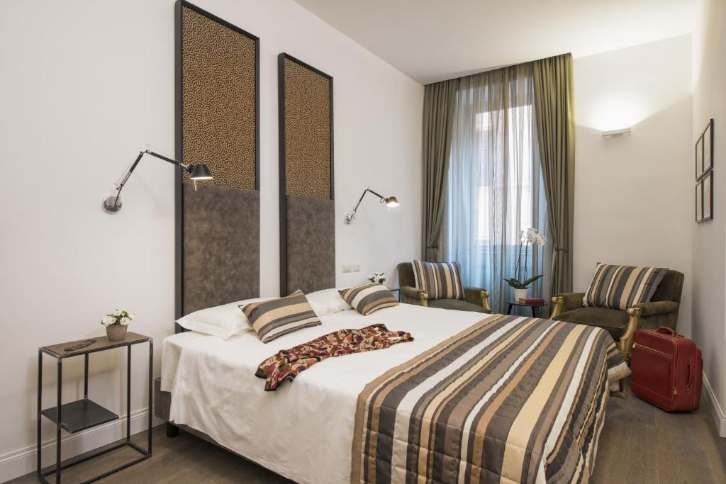 Postel nebo postele na pokoji v ubytování Maison Evelina