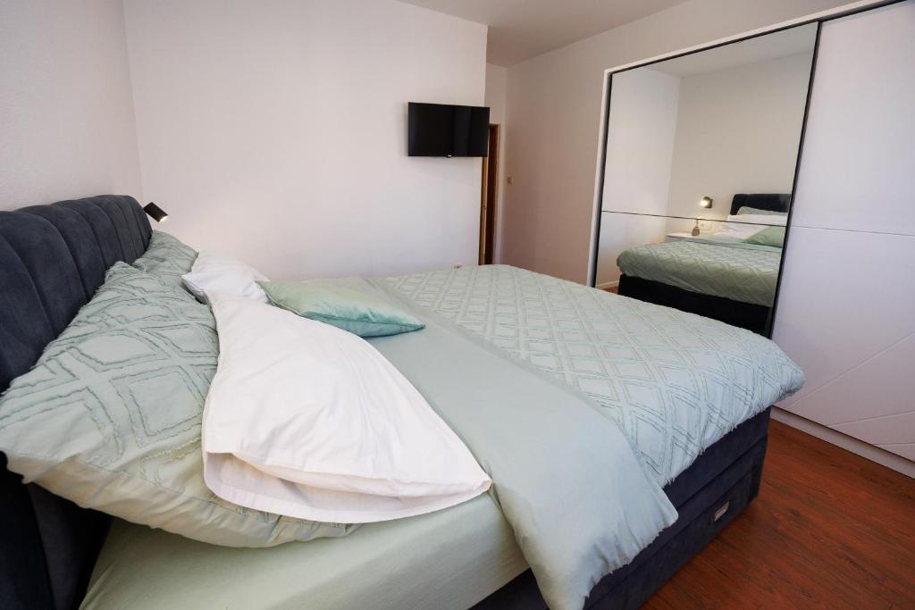 Łóżko lub łóżka w pokoju w obiekcie Apartment Nikoleto