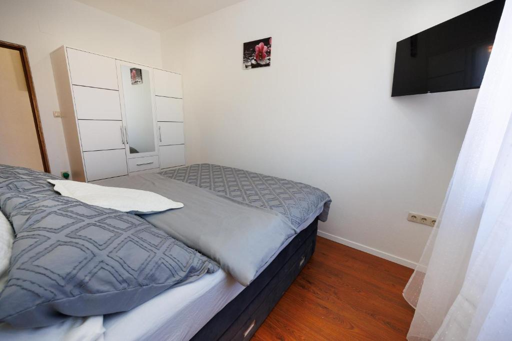 Łóżko lub łóżka w pokoju w obiekcie Apartment Nikoleto