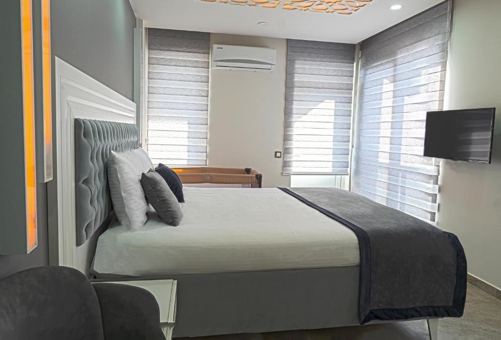 Postel nebo postele na pokoji v ubytování Mira Hotel Antalya