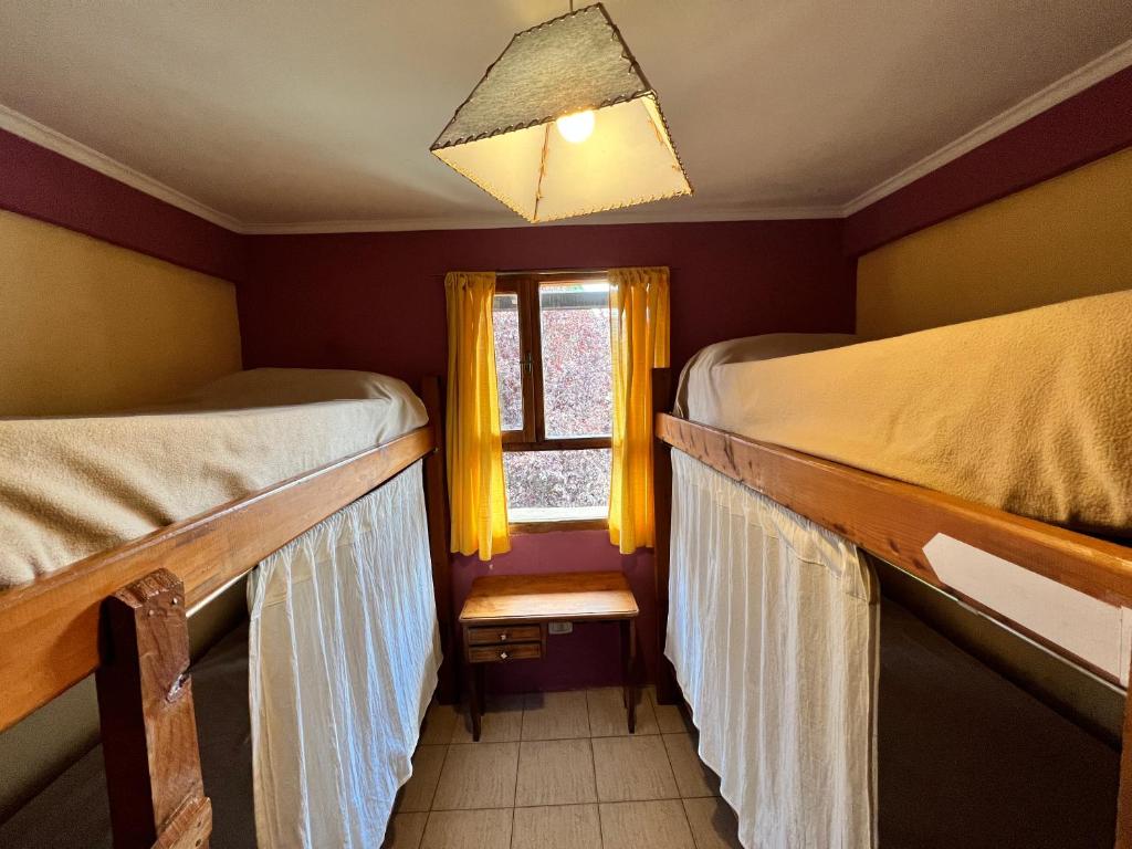 Postel nebo postele na pokoji v ubytování Ankatu Hostel