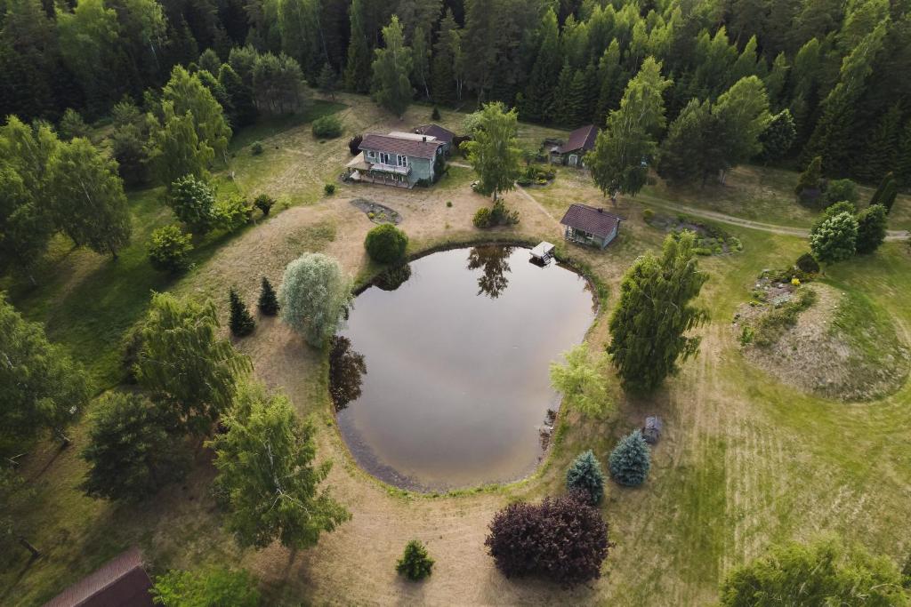 an aerial view of a house with a lake at Susimetsa 
