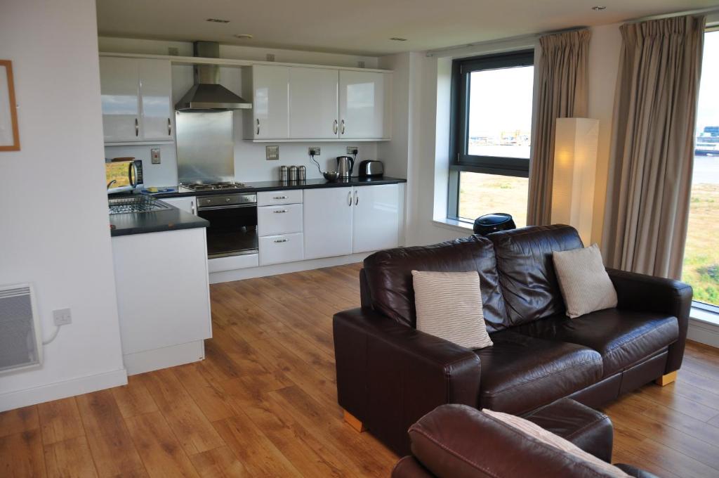 Kuchyň nebo kuchyňský kout v ubytování Ocean Serviced Apartments