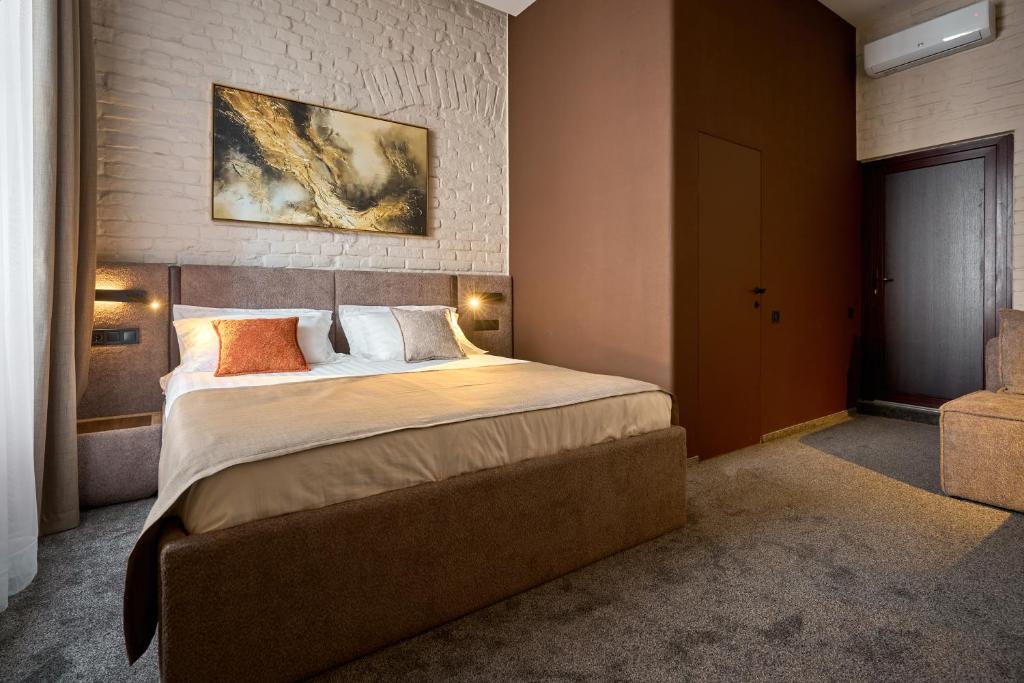 Postel nebo postele na pokoji v ubytování FIMKA Apart Hotel