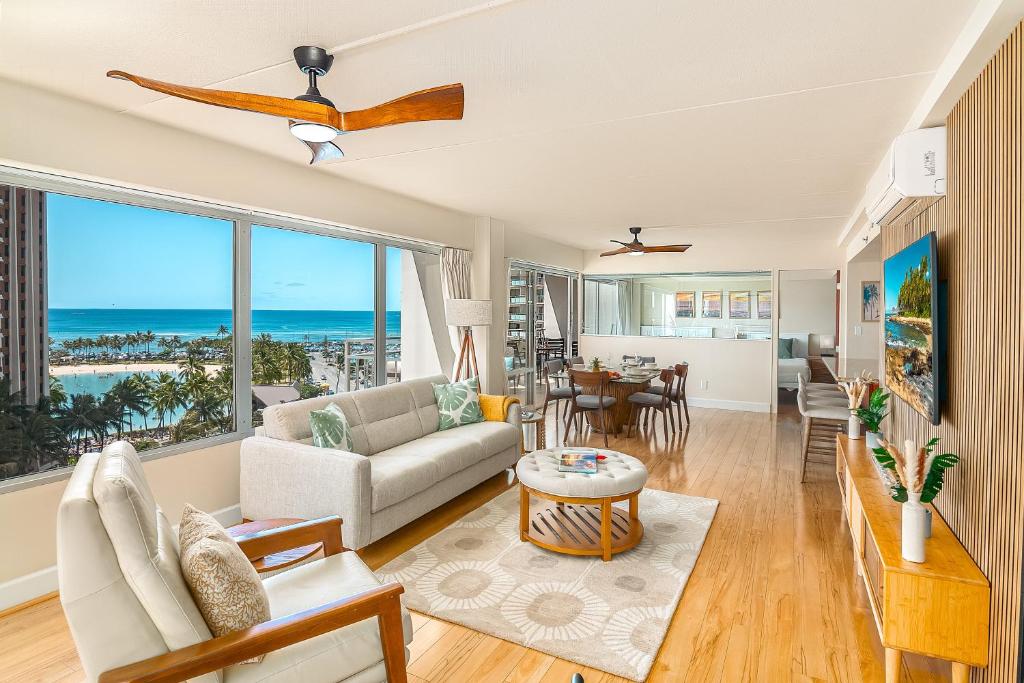 a living room with a view of the ocean at Welcome to Your Slice of Paradise at Ilikai Hotel in Honolulu