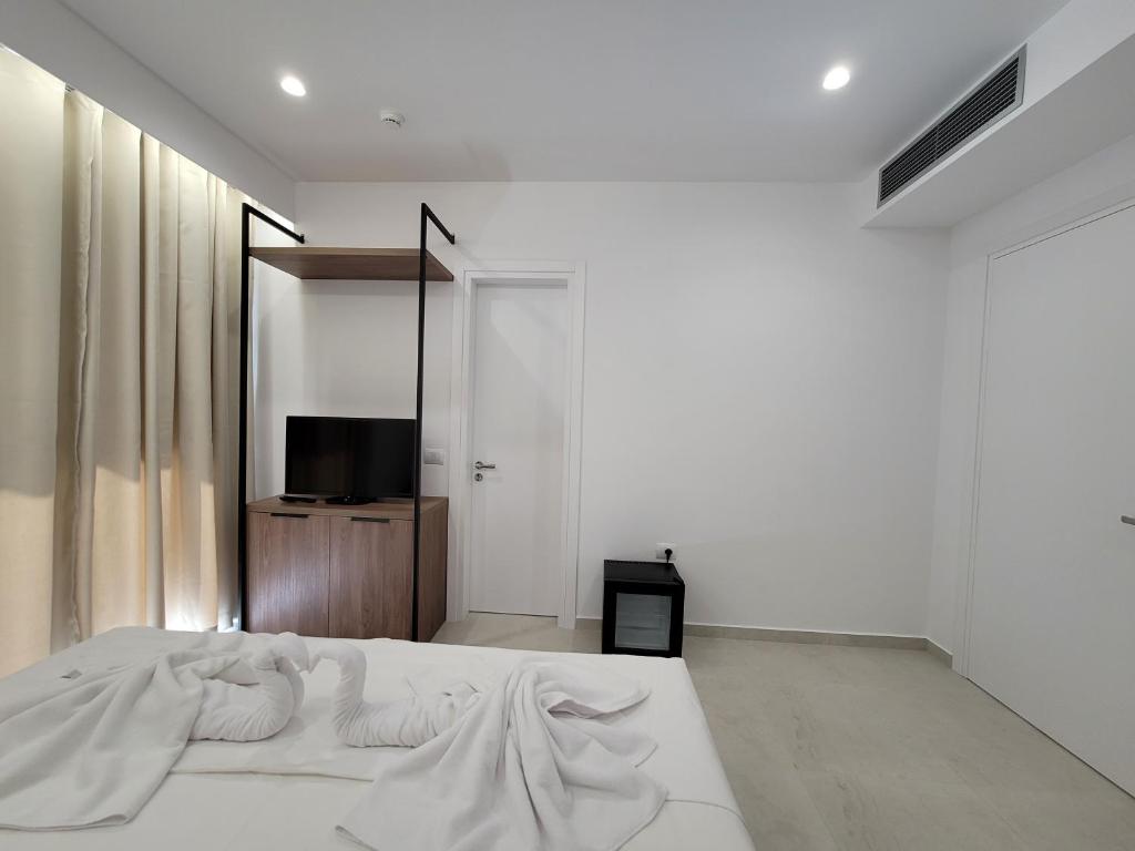 Postel nebo postele na pokoji v ubytování Prestige Hotel