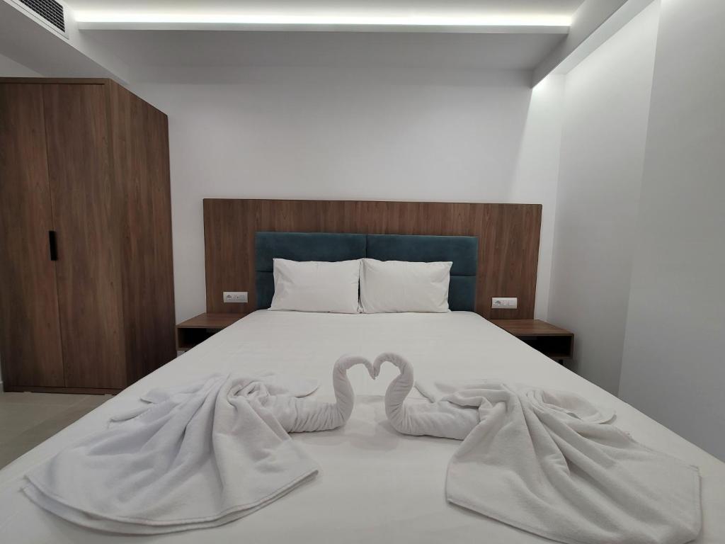 Postel nebo postele na pokoji v ubytování Prestige Hotel