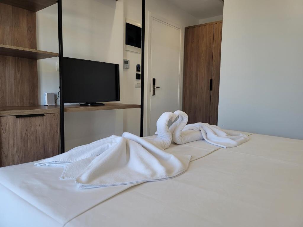 Postel nebo postele na pokoji v ubytování Prestige Hotel