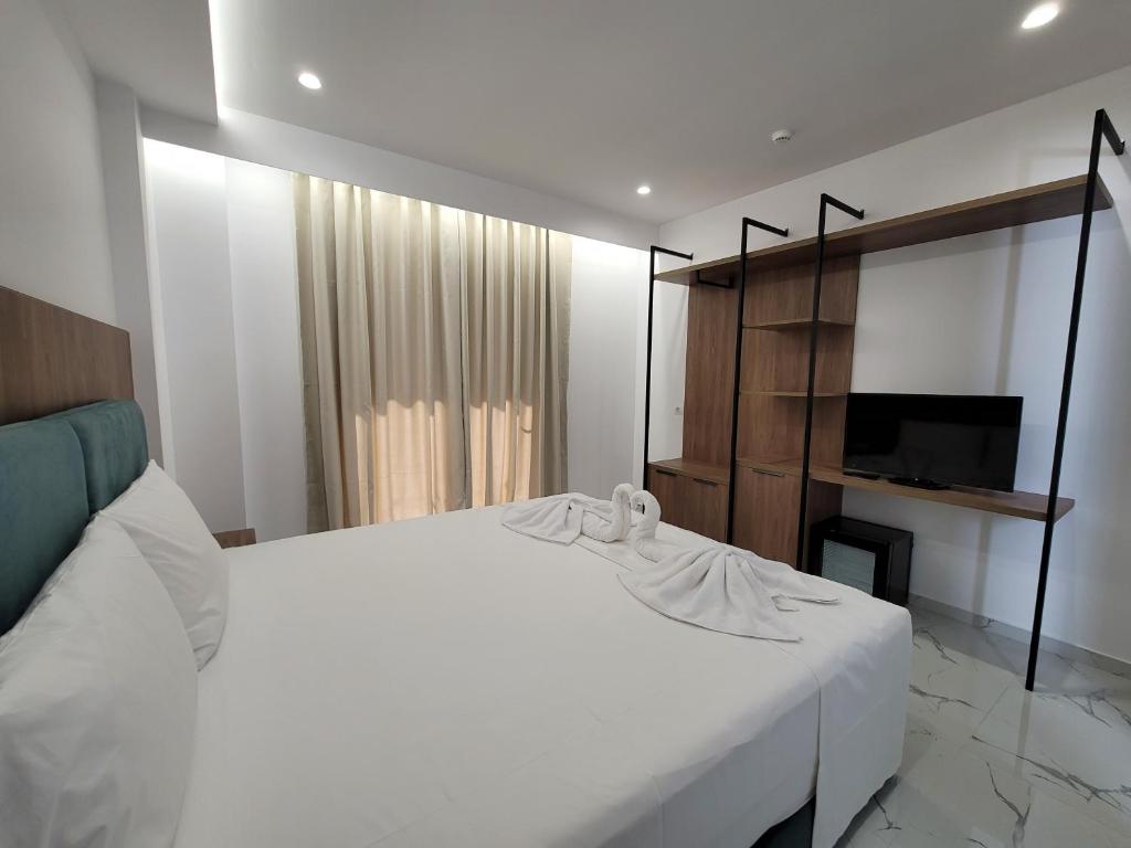 Postel nebo postele na pokoji v ubytování Prestige Hotel