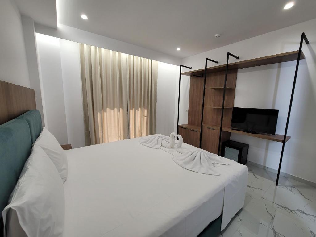Postel nebo postele na pokoji v ubytování Prestige Hotel