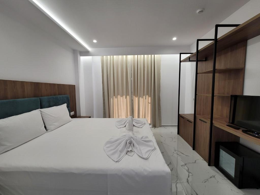 Postel nebo postele na pokoji v ubytování Prestige Hotel