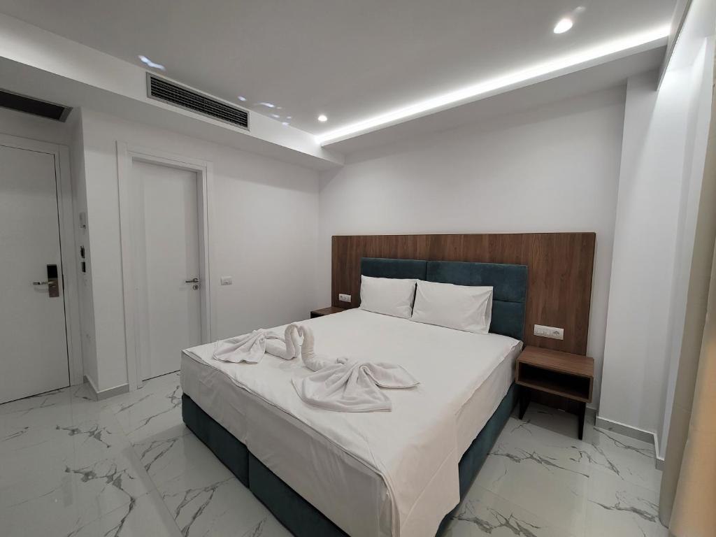 Postel nebo postele na pokoji v ubytování Prestige Hotel
