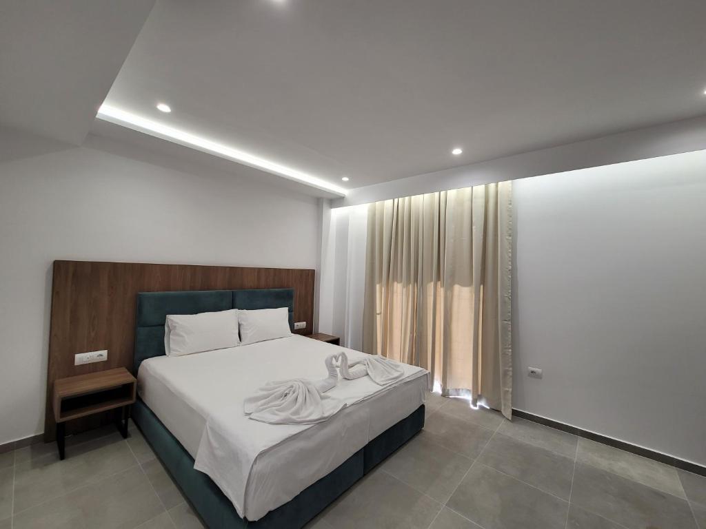 Postel nebo postele na pokoji v ubytování Prestige Hotel