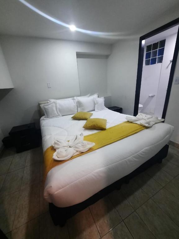 Postel nebo postele na pokoji v ubytování Hotel Zafiro Boutique