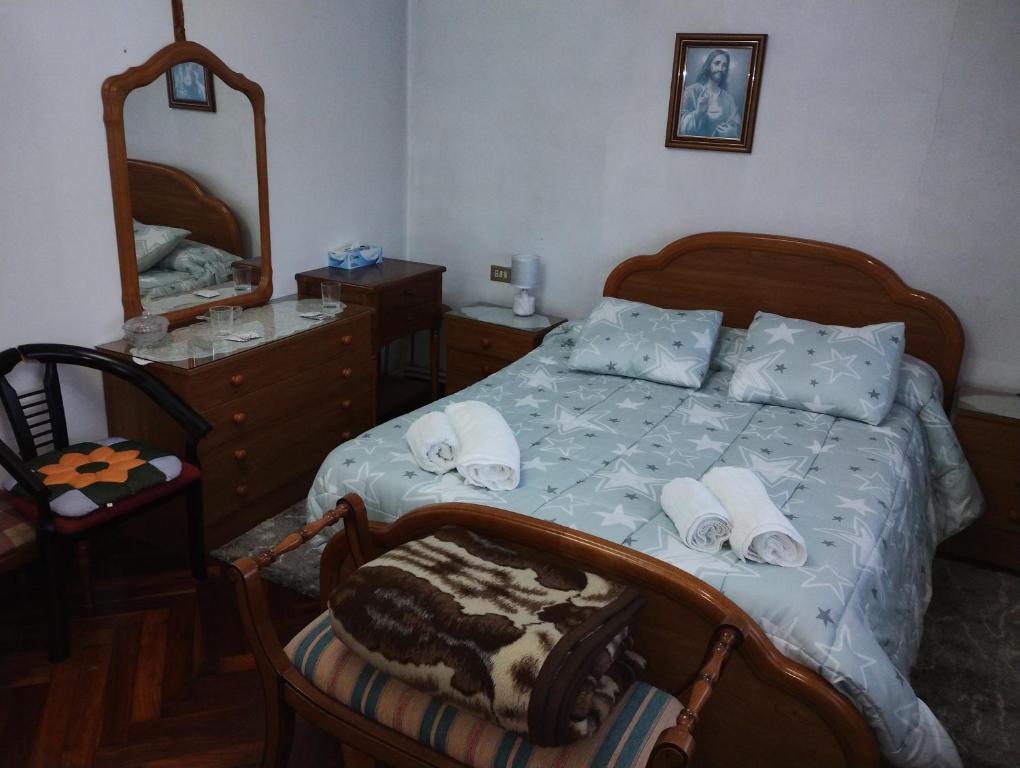 A bed or beds in a room at Casa Jesús
