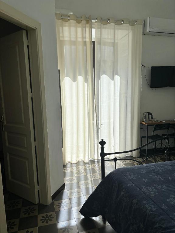 Posteľ alebo postele v izbe v ubytovaní Il Teatro Rooms