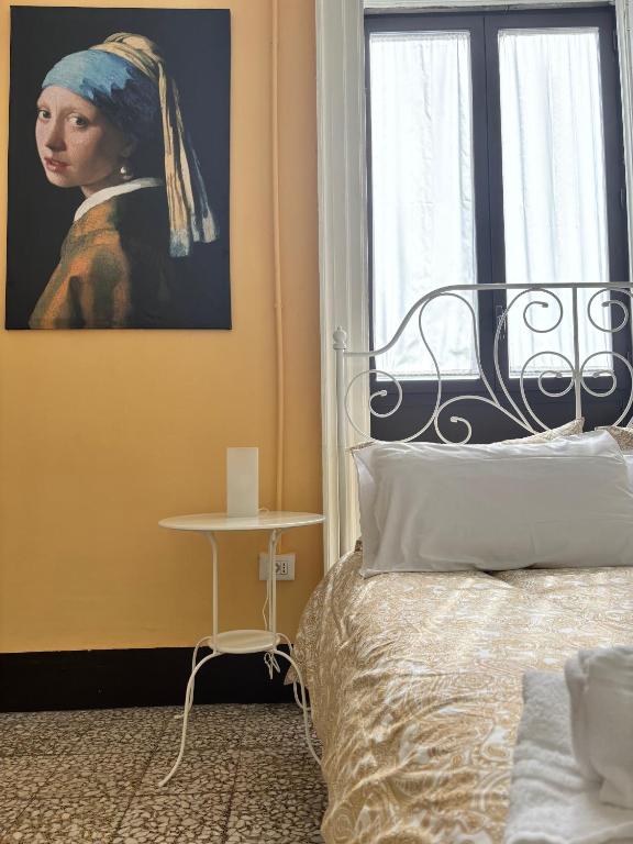 Posteľ alebo postele v izbe v ubytovaní Il Teatro Rooms