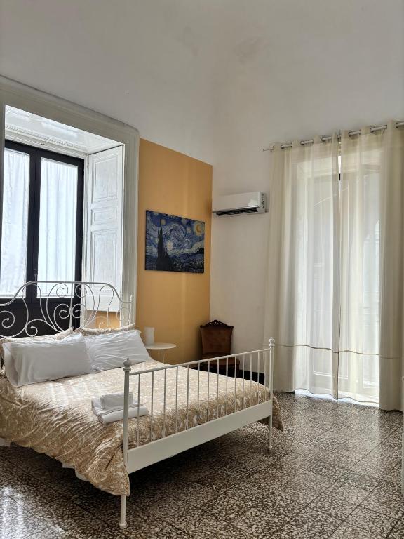 Posteľ alebo postele v izbe v ubytovaní Il Teatro Rooms