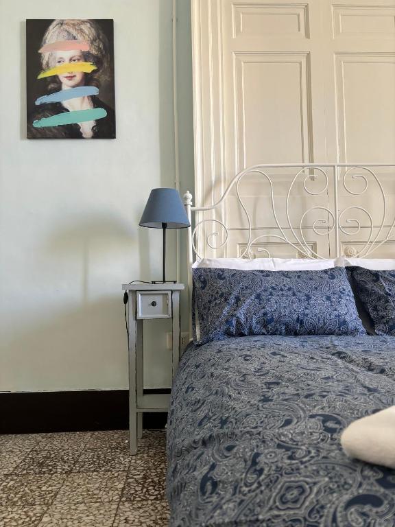 Posteľ alebo postele v izbe v ubytovaní Il Teatro Rooms