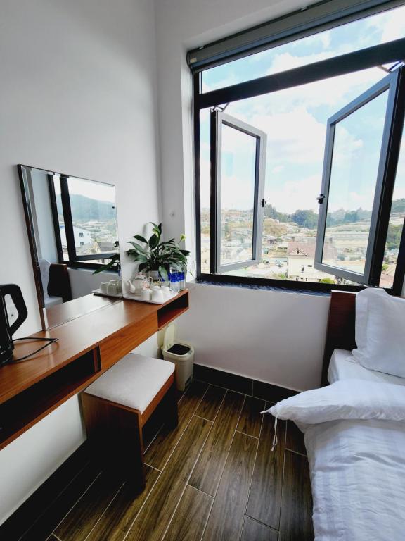Postel nebo postele na pokoji v ubytování Happy Bun Hotel Da Lat