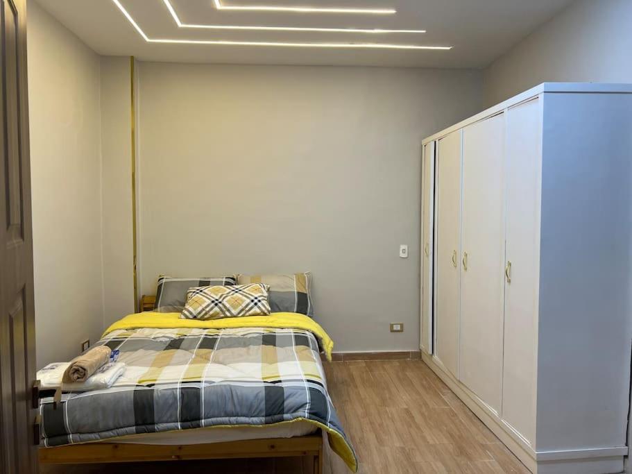 Postel nebo postele na pokoji v ubytování Urban Elegance @ Maadino6
