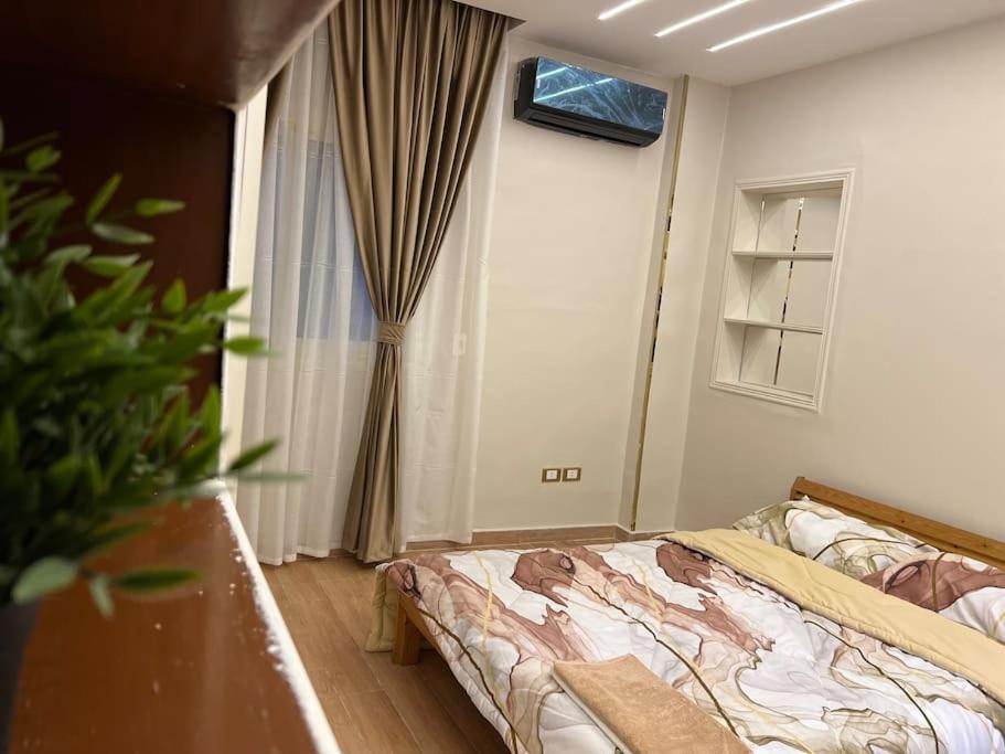 Postel nebo postele na pokoji v ubytování Urban Elegance @ Maadino6