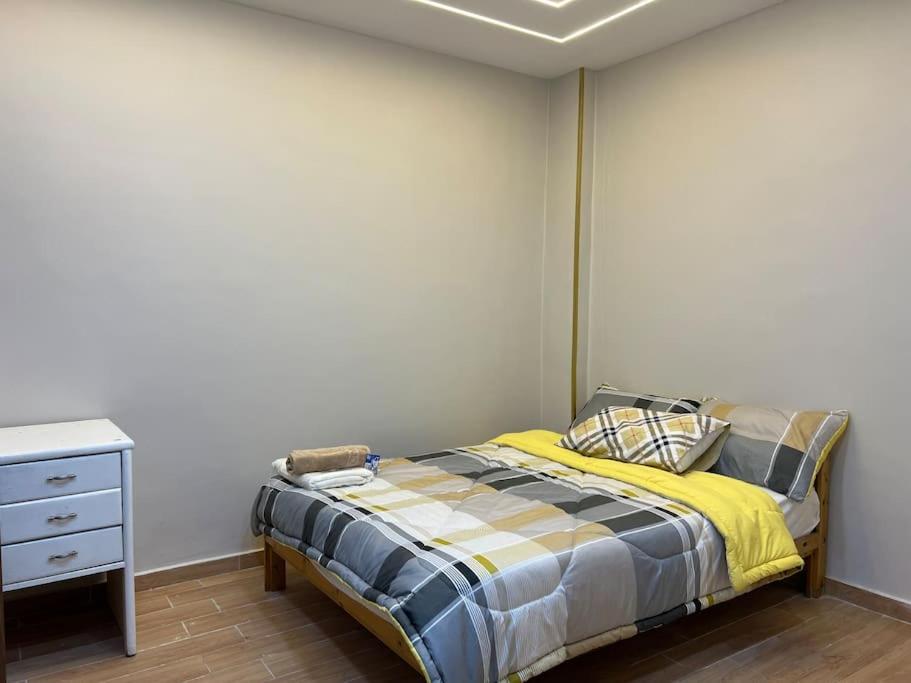 Postel nebo postele na pokoji v ubytování Urban Elegance @ Maadino6
