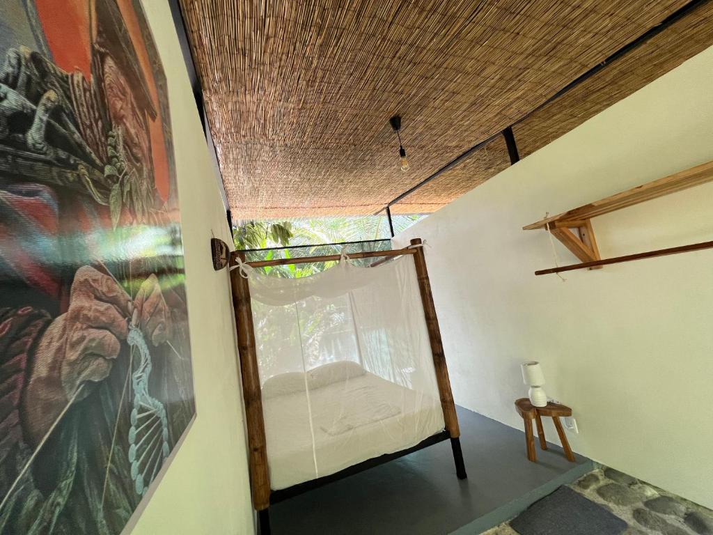 Postel nebo postele na pokoji v ubytování Templo del Tigre