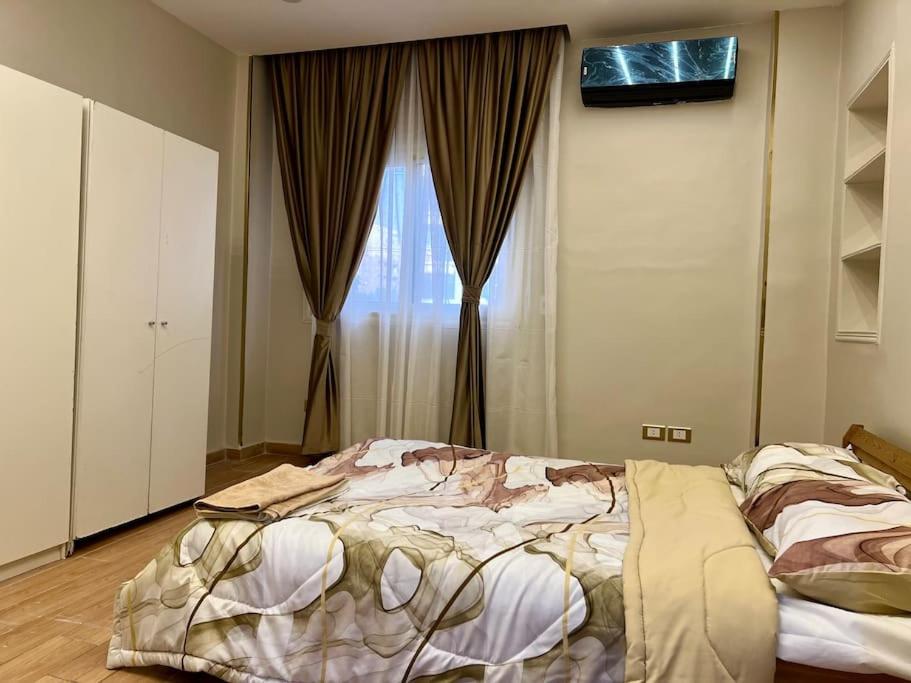 Postel nebo postele na pokoji v ubytování Urban Elegance @ Maadino6