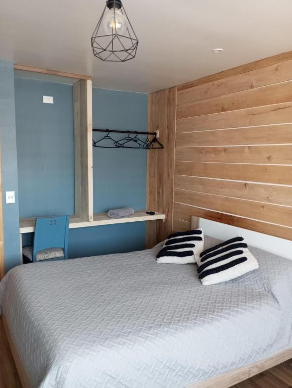 Postel nebo postele na pokoji v ubytování Casa Boqui Hostal