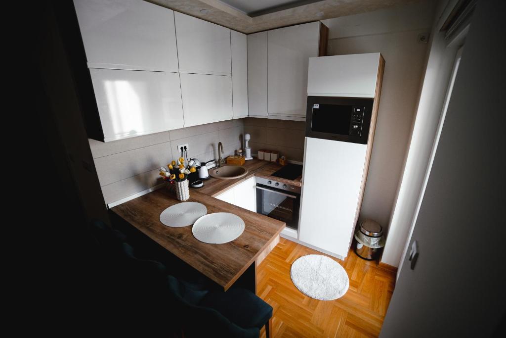 Kuchyň nebo kuchyňský kout v ubytování Apartman VELUK