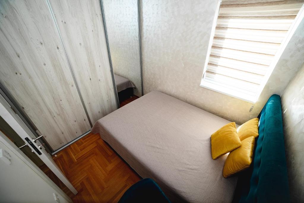 Postel nebo postele na pokoji v ubytování Apartman VELUK
