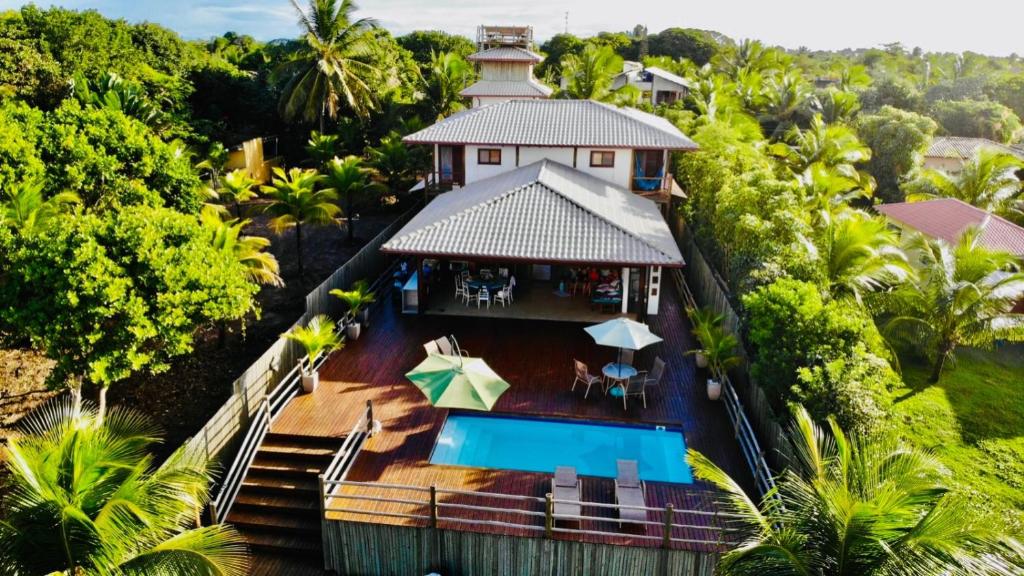 an aerial view of a house with a swimming pool at Casa Uluwatu - Barra Grande - Bahia in Marau