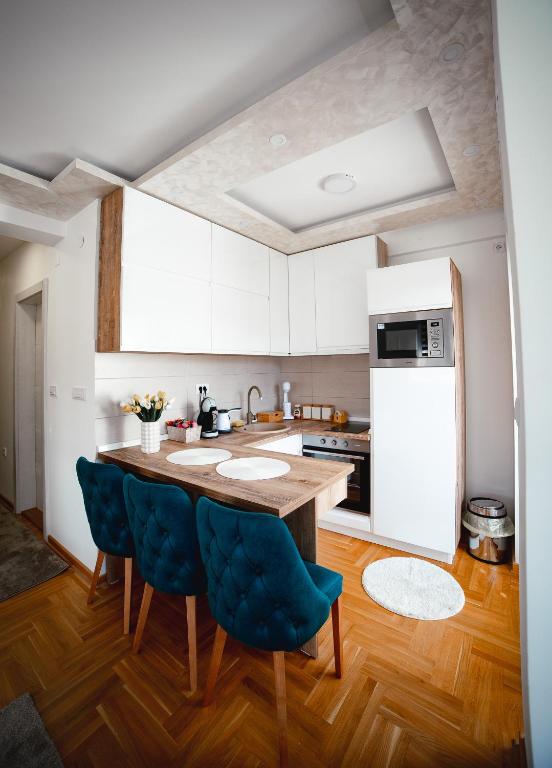 Kuchyň nebo kuchyňský kout v ubytování Apartman VELUK
