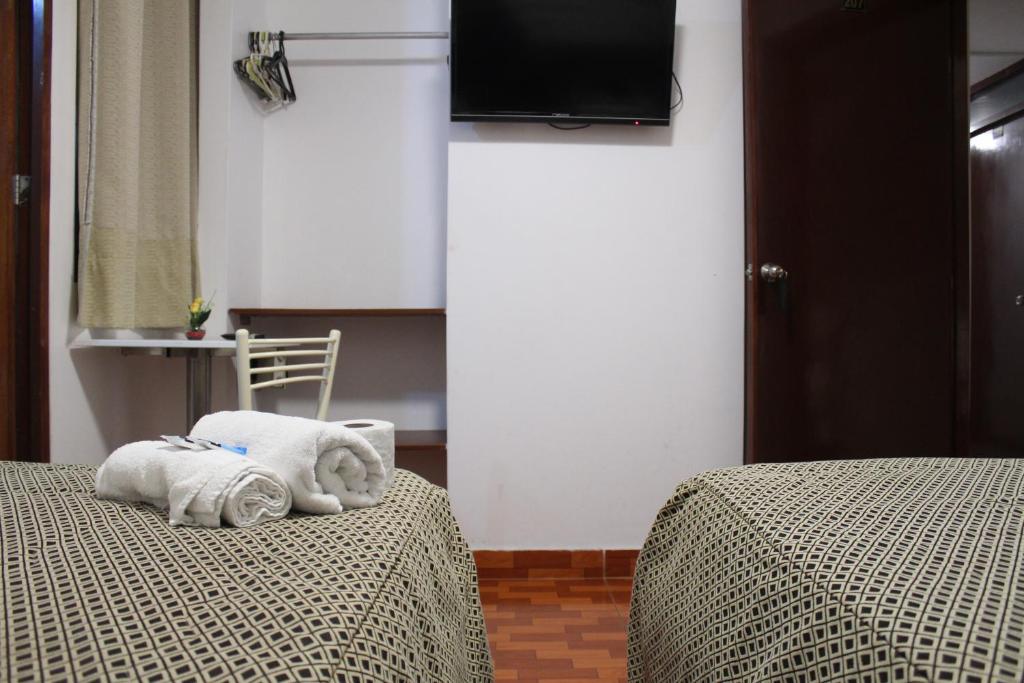 Postel nebo postele na pokoji v ubytování COPACABANA