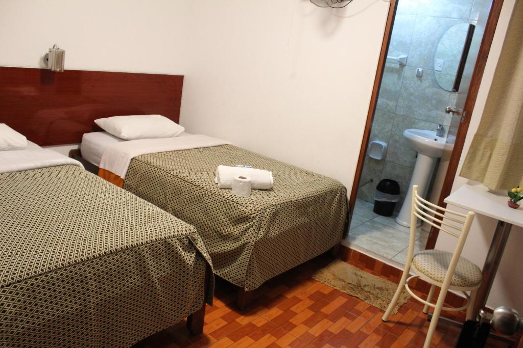 Postel nebo postele na pokoji v ubytování COPACABANA