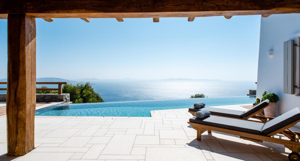 a view of a swimming pool from a villa at Villa Olivia Mykonos in Agios Stefanos