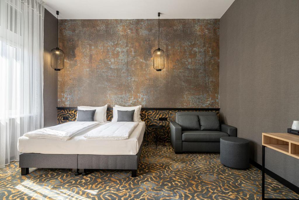 Postel nebo postele na pokoji v ubytování URBAN HOTEL