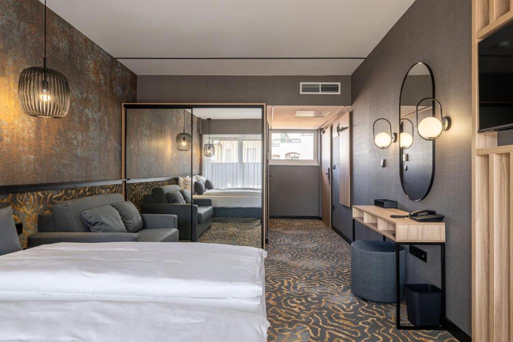 Postel nebo postele na pokoji v ubytování URBAN HOTEL