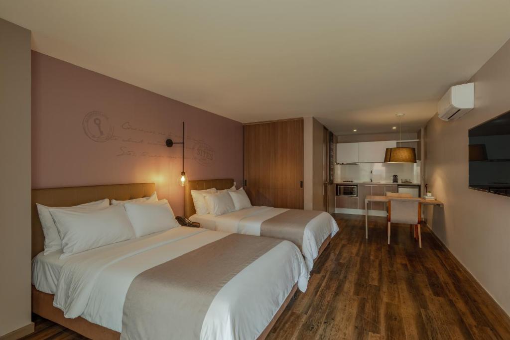 Cama o camas de una habitación en Sites Hotel
