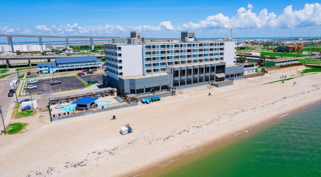an aerial view of a hotel on the beach at DoubleTree by Hilton Corpus Christi Beachfront in Corpus Christi