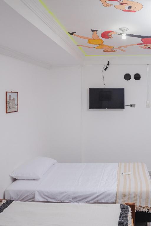 Cama o camas de una habitación en HOSTAL CASA TIO POLI