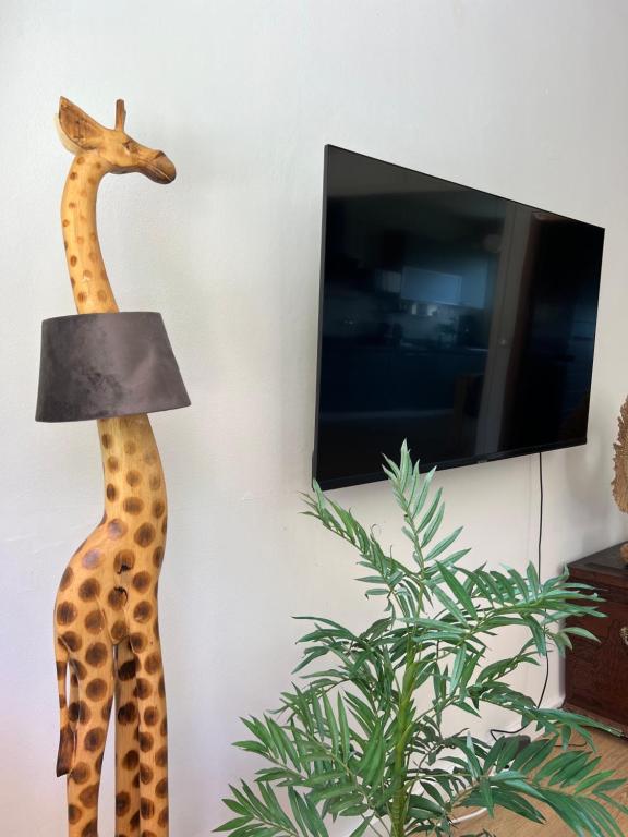 TV a/nebo společenská místnost v ubytování Vistas al mar y barbacoa