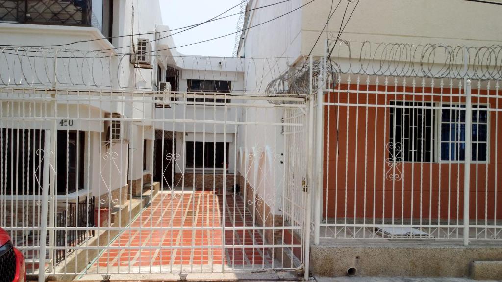 a building is being constructed with a metal fence at casa javi in Santa Marta