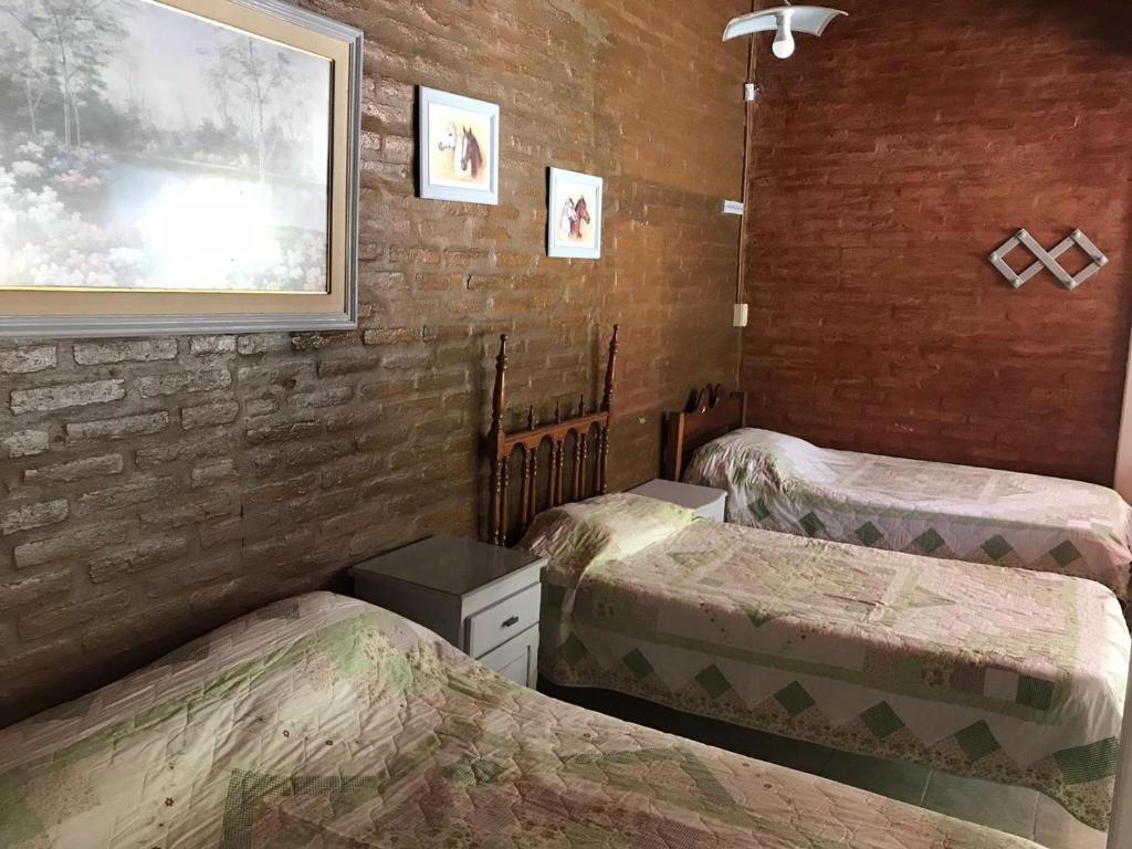 Postel nebo postele na pokoji v ubytování Cabañas Don David