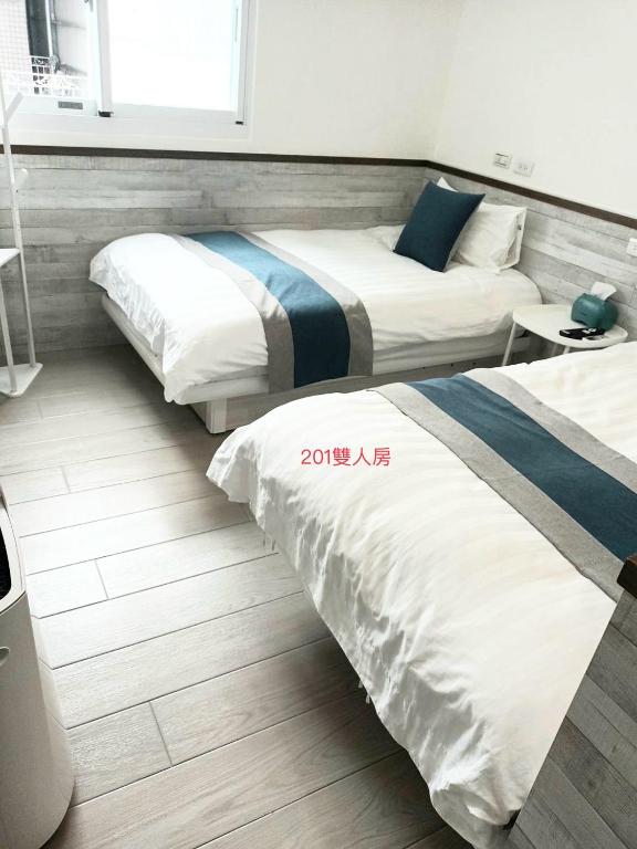 Postel nebo postele na pokoji v ubytování Xiaomi Courtyard B&B