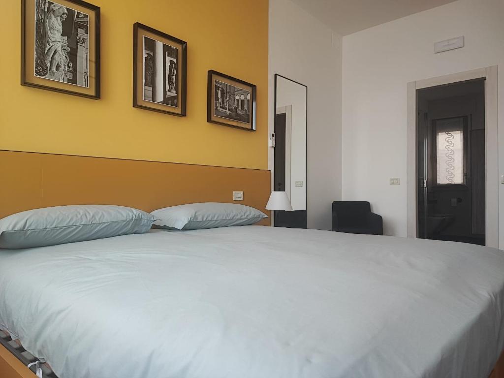 Postel nebo postele na pokoji v ubytování Foresteria Juvarra